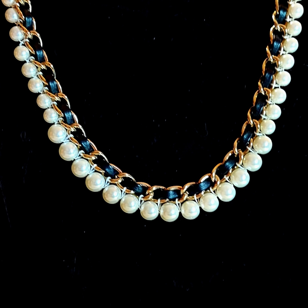 Gold tone, pearl necklace with black leather